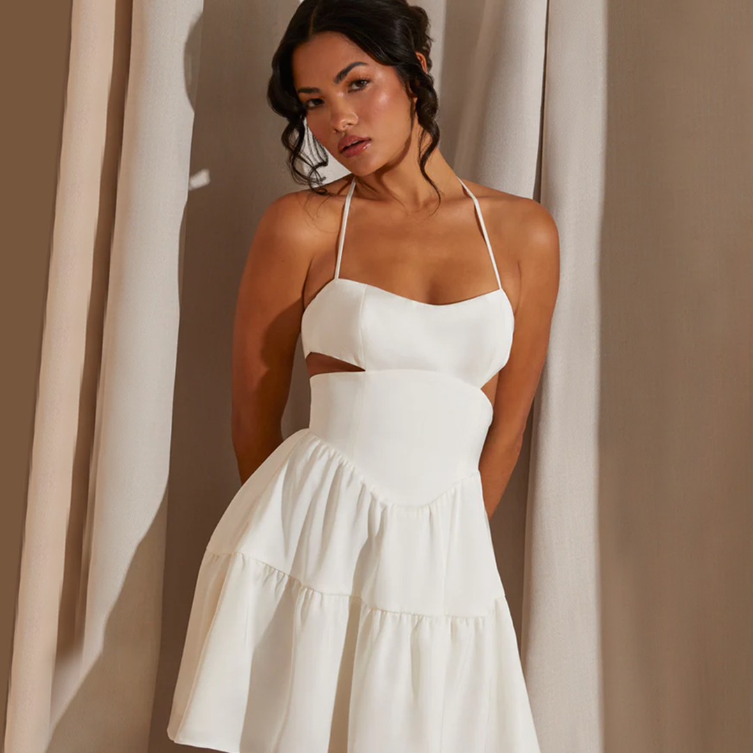 Pure Elegance: The Enchanting White Halter Neck Cut Out Mini Dress